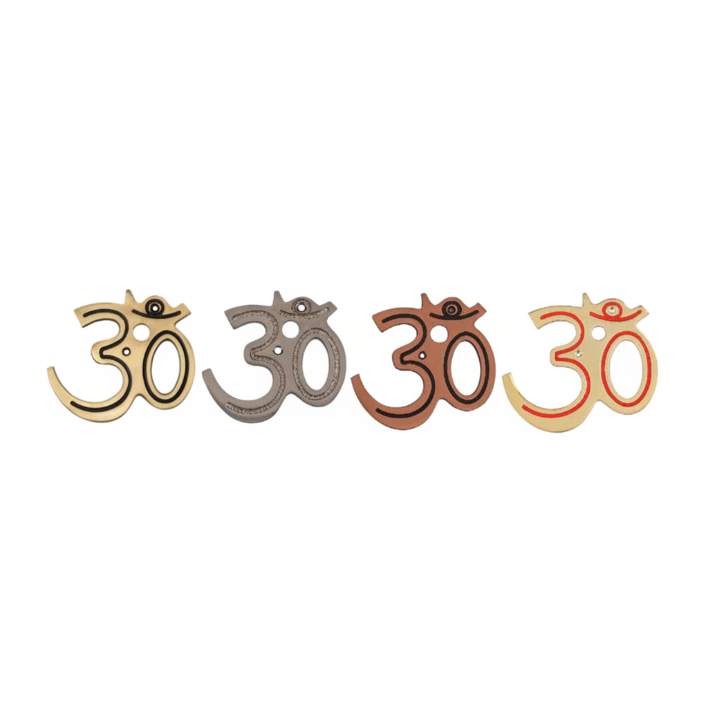 Fab0226 metal Om wall accents featuring a modern curved Devanagari script with recessed decorative borders, shown in antique brass, copper, satin, gold and red mina finishes with dual mounting holes.