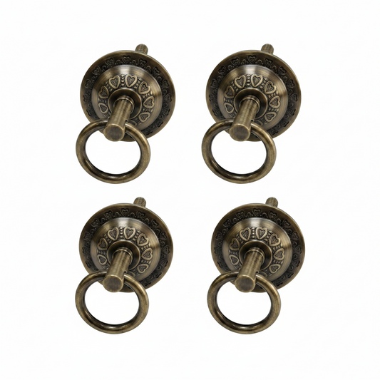 antique brass finish bottom kada for jhula seats featuring a decorative heart-shaped embossed pattern and heavy-duty pivot ring for traditional indoor swings.