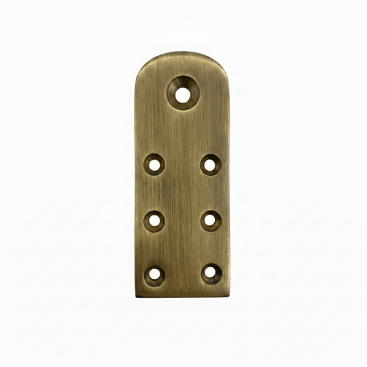 A premium DLP169 Jhula rope bottom patti (mounting plate) featuring a vintage antique brass finish. This heavy-duty structural plate is designed with seven reinforced countersunk holes for secure attachment to wooden swing seats. It serves as a high-strength anchor point for hanging ropes and chains, offering a traditional aesthetic and reliable load support for luxury indoor swings and ethnic home decor.
