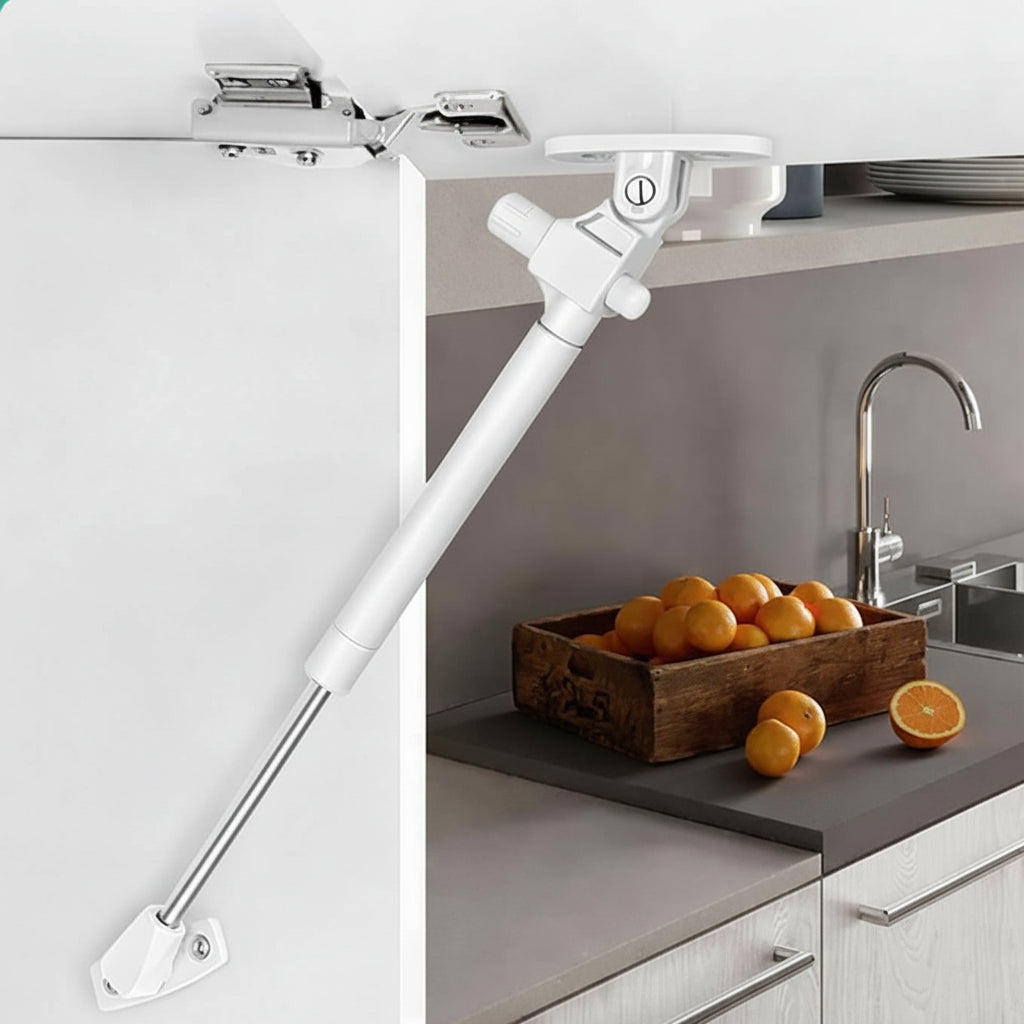 A modern kitchen cabinet installation featuring a white 10-inch soft-close hydraulic gas pump lift support. The image demonstrates the pneumatic strut in action, securely holding an overhead cabinet door open to provide hands-free access to kitchen storage. This professional-grade hardware ensures a controlled, silent closing motion, making it an ideal upgrade for contemporary kitchen cabinetry and space-saving furniture designs.