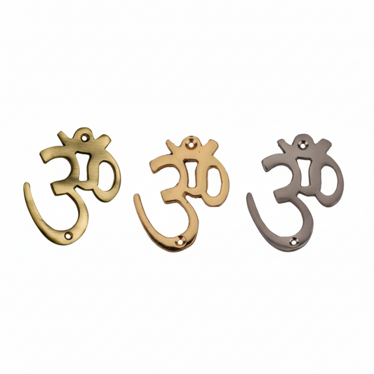 Fab0264 metal Om wall symbols in antique brass, gold, and satin finishes featuring a traditional Devanagari script design with dual top-and-bottom mounting holes for secure installation.
