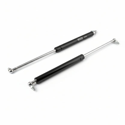 A pair of Aaskon 12-inch heavy-duty hydraulic gas pumps in a durable black and silver finish, featuring a high-load capacity of 30kg. These professional-grade pneumatic struts are equipped with high-pressure steel cylinders and reinforced ball joint connectors with threaded bolts for secure mounting. They are designed to provide powerful, controlled lifting and a stable hold for heavy kitchen cabinet doors, industrial storage lids, and automotive applications.