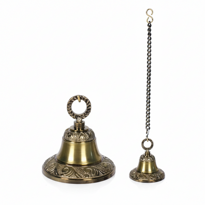 Fab2174 antique brass hanging bell featuring intricate Nakshi floral engravings on the rim and shoulder, a decorative twisted rope-style mounting loop, and a matching metal link chain with an S-hook