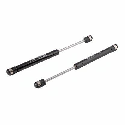 A pair of Aeron 9-inch hydraulic gas pumps in a sleek black finish, each with a 10kg load capacity. These professional-grade pneumatic lift supports feature high-pressure cylinders and reinforced ball joint connectors for smooth, silent operation. Ideal for providing controlled lift and hold for kitchen cabinet doors, storage lids, and lightweight furniture panels.