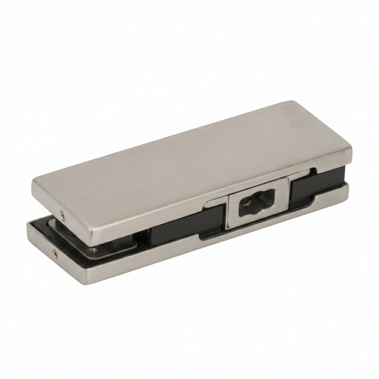 A premium bottom patch fitting for frameless glass doors, featuring a silver finish and a rectangular design. This architectural hardware includes a universal cutout for floor spring spindles, internal protective rubber gaskets, and a reinforced mounting system to ensure a secure, damage-free grip on glass panels. Ideal for modern commercial entryways and office partitions, providing a sleek and stable pivot point for heavy-duty glass door systems.