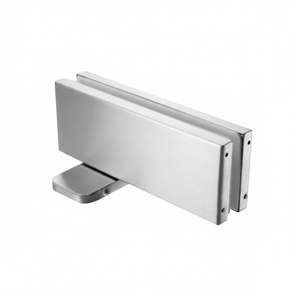 A heavy-duty bottom patch fitting for frameless glass doors, featuring a high-quality brushed stainless steel finish and a rectangular profile designed for secure floor pivot mounting in commercial or residential glass entryways.