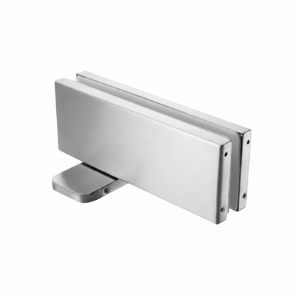 A heavy-duty bottom patch fitting for frameless glass doors, featuring a high-quality brushed stainless steel finish and a rectangular profile designed for secure floor pivot mounting in commercial or residential glass entryways.