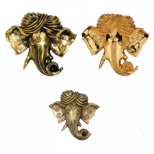 Lord Ganesha wall hangings featuring detailed faces with traditional turbans (pagdi) in various metallic finishes, including antique brass, polished gold, and weathered bronze, for home temple or entryway decoration.