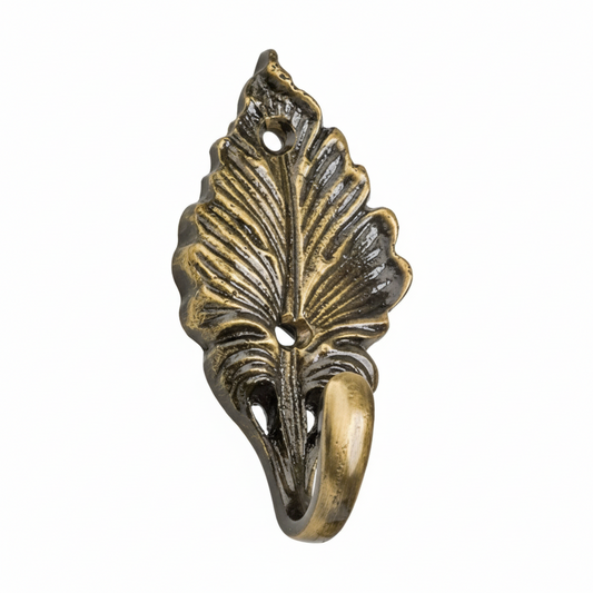 An ornate decorative wall hook featuring a highly detailed leaf design with prominent veining in an antique brass finish. The botanical-style hardware includes two pre-drilled mounting holes and a smooth curved hook for hanging keys, jewelry, or light accessories.