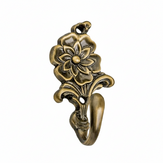 An ornate decorative wall hook featuring a highly detailed multi-layered flower design in an antique brass finish. The vintage-style hardware includes two pre-drilled mounting holes and a smooth curved hook for hanging coats, jewelry, or light accessories.