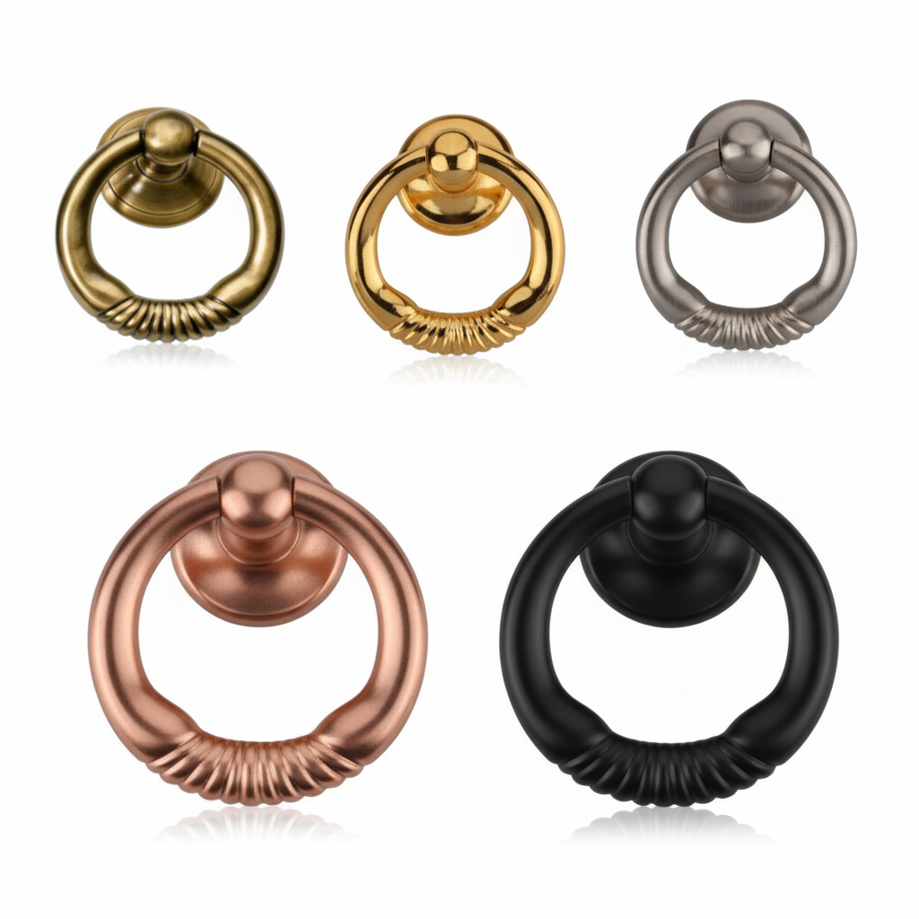 A collection of five decorative round ring pull handles for furniture and cabinets, featuring textured bottom grips and shown in various premium finishes: antique brass, gold, satin nickel, rose gold, and black