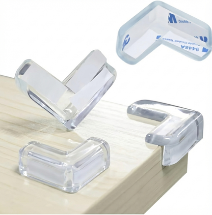 Transparent PVC corner guards with adhesive backing installed on table edges, providing child safety protection and impact-resistant cushioning for furniture corners.