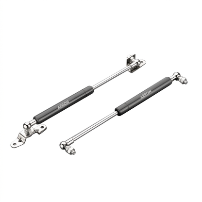 A pair of Aeron premium gas struts featuring a matte charcoal finish and high-strength polished hydraulic rods. These lift supports include pre-installed mounting brackets and ball joint connectors, designed to provide smooth, controlled opening and soft-close support for heavy cabinet doors, storage chests, and automotive applications.