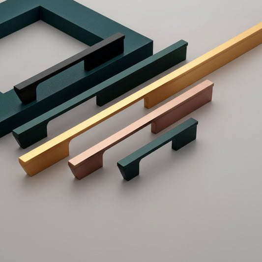 A premium collection of Creatick AL-60 modern cabinet handles featuring a bold, geometric wedge-shaped profile and a sleek flat top. These minimalist aluminum pulls are shown in various lengths and designer finishes including matte black, satin gold, and rose gold—an ideal hardware choice for high-end kitchen cabinetry, luxury wardrobes, and contemporary furniture design.
