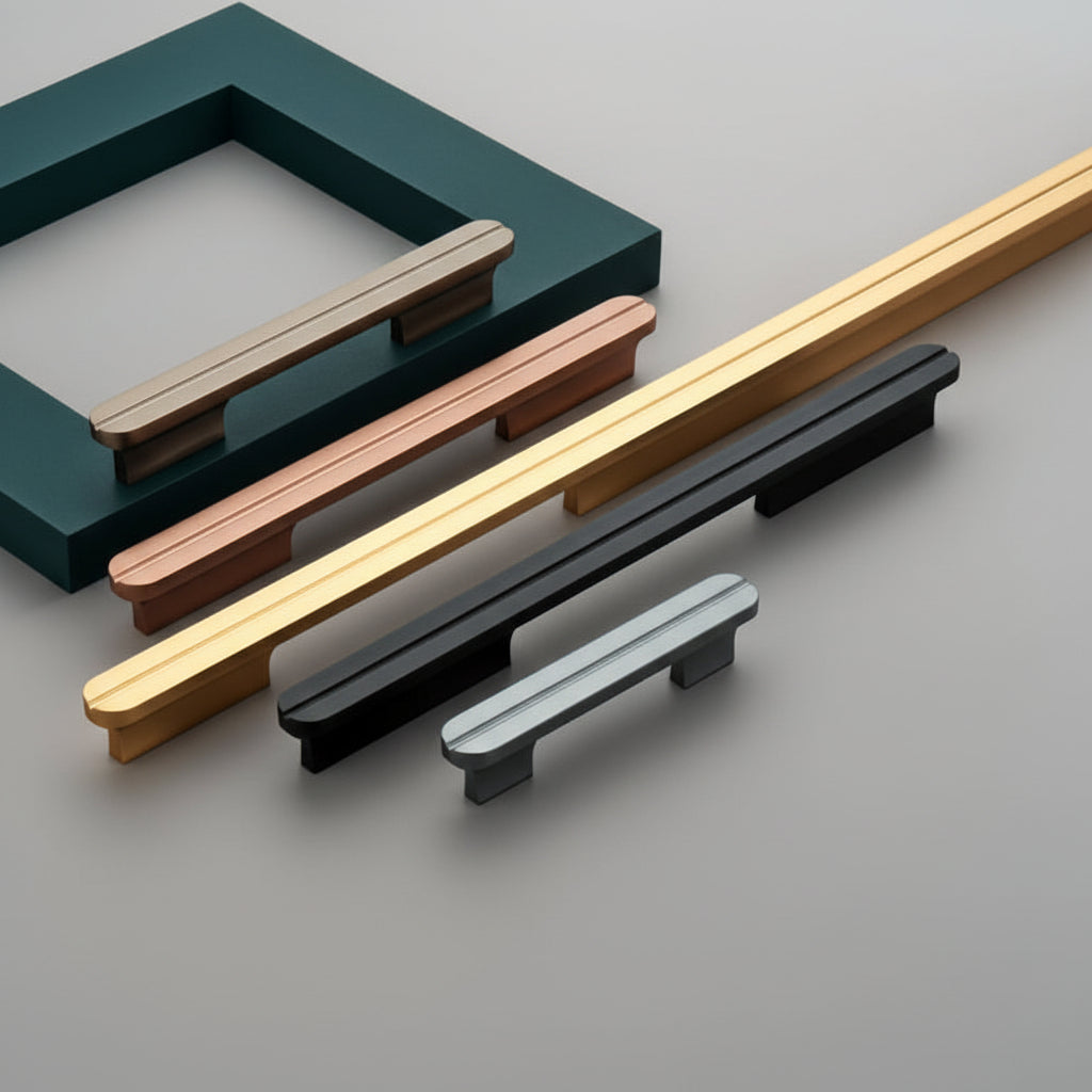 A premium collection of Creatick AL-75 modern cabinet handles featuring a sleek pill-shaped profile with a distinctive central longitudinal groove. These minimalist aluminum pulls are shown in various lengths and designer finishes including antique brass, rose gold, satin gold, matte black, and slate grey—an ideal hardware choice for high-end kitchen cabinetry and contemporary furniture design.