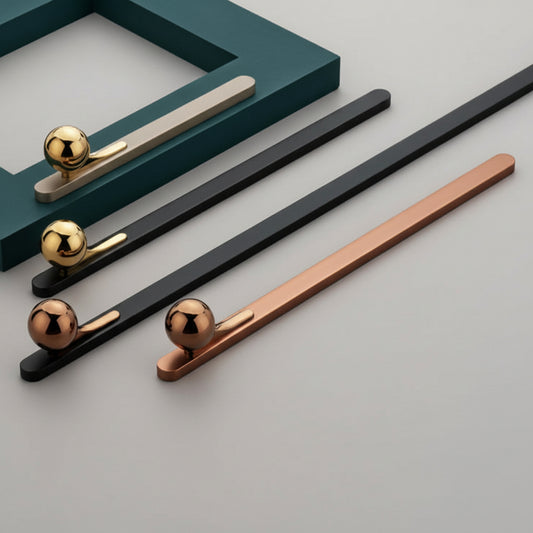 A luxury collection of Creatick AL-76 modern cabinet handles featuring a unique minimalist flat bar design accented by a polished spherical globe knob. These artistic designer pulls are shown in various finishes including matte black with gold, satin silver, and brushed rose gold—perfect for high-end kitchen cabinetry, bespoke wardrobes, and contemporary furniture hardware.
