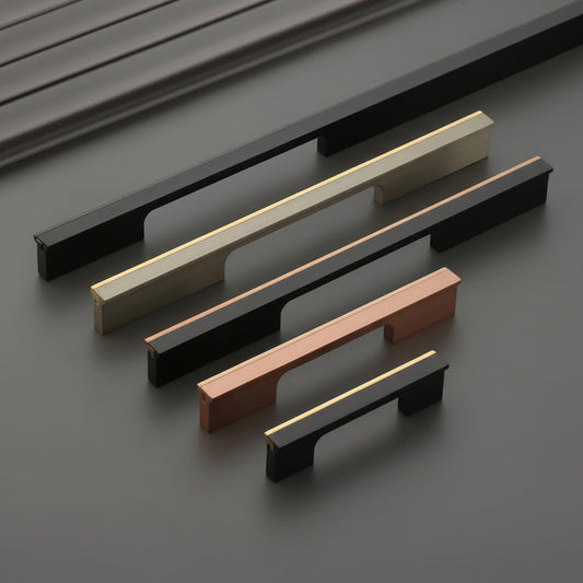 A luxury collection of Creatick AL-82 modern cabinet handles featuring a sleek, rectangular architectural profile with a sophisticated gold-edge accent. These premium aluminum pulls are shown in various lengths and designer finishes including matte black with gold, antique brass, and brushed copper—perfect for high-end kitchen cabinetry and contemporary designer furniture.