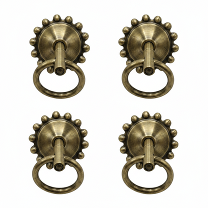 antique brass finish SS-304 bottom kada with a sunburst floral edge and heavy-duty pivot ring for traditional jhula seat mounting.