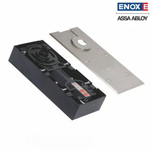 A high-performance ENOX (Assa Abloy) hydraulic floor spring assembly featuring a heavy-duty black cement box housing and a matching satin stainless steel cover plate. This architectural floor-mounted closer is designed for recessed installation, providing invisible and durable door control for frameless glass, timber, or metal doors. It includes integrated valves for adjustable closing and latching speeds, ideal for modern commercial entrances and high-end residential interiors.