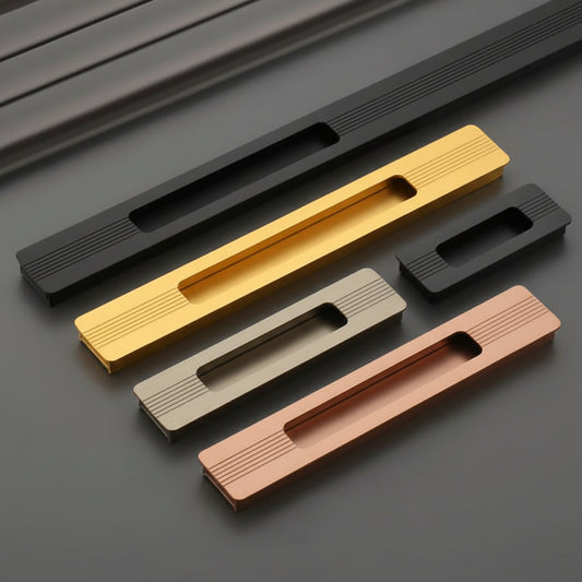 A premium collection of Creatick modern concealed cabinet handles featuring a sleek recessed grip and subtle linear etched details. These minimalist built-in furniture pulls are shown in matte black, polished gold, satin champagne, and rose gold finishes, available in various lengths—ideal for luxury kitchen cabinets, sliding doors, and contemporary wardrobe hardware.