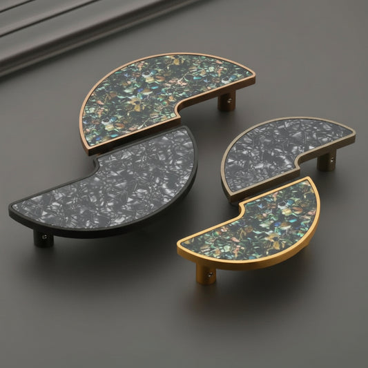 A luxury collection of Creatick DH-107 modern semi-circle cabinet handles featuring sophisticated terrazzo and crushed stone inlays. These artistic furniture pulls are shown in matte black, antique brass, and polished gold frames with emerald green and monochrome stone textures—ideal for high-end kitchen cabinetry and bespoke furniture design.