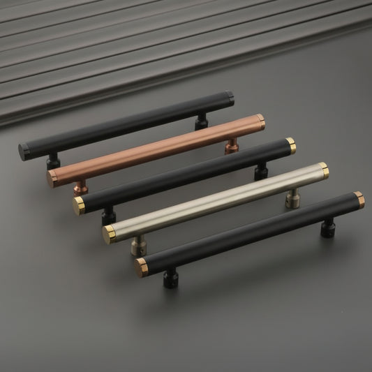A premium collection of Creatick DH-32 modern cylindrical door pull handles featuring a sleek minimalist profile with contrast-finish end caps. These luxury hardware handles are shown in matte black with gold accents, brushed rose gold, and satin silver finishes, providing an elegant architectural statement for contemporary main entry doors and interior decor.