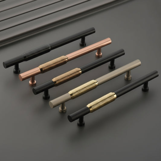 A premium collection of Creatick DH-35 modern door pull handles featuring a cylindrical profile with a central ribbed texture for a sophisticated grip. These luxury hardware handles are shown in dual-tone finishes including matte black with gold, rose gold, and champagne accents, ideal for high-end main entry doors and contemporary architectural projects.