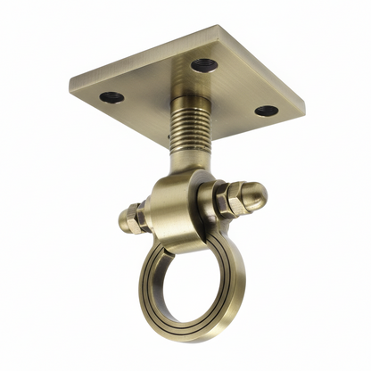 A premium DLP153 ceiling-mounted Jhula hook (Kada) featuring a classic antique brass finish. This heavy-duty swinging chair hook is designed with a square mounting plate, a reinforced threaded stem, and a smooth-rotating ring for friction-free movement. Ideal for hanging indoor swings, hammocks, or heavy decorative fixtures, providing a blend of traditional Indian aesthetic and high-load structural reliability.