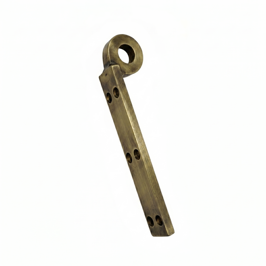 A premium DLP165 "Batak Kada" mounting bracket featuring a vintage antique brass finish. This heavy-duty L-shaped structural hardware is designed for the secure installation of wooden Jhula seats, featuring a reinforced circular eyelet and six precision countersunk holes for a flush fit. Ideal for luxury indoor swings and traditional Indian furniture, providing a blend of classic aesthetic and high load-bearing structural safety.