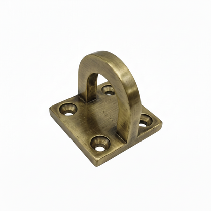 A premium DLP166 D-hook mounting bracket featuring a vintage antique brass finish. This heavy-duty hardware includes a reinforced U-shaped anchor loop on a thick square base plate with four precision-drilled countersunk holes for secure installation. Ideal for mounting indoor swings (Jhulas), hanging chairs, or decorative architectural fixtures, combining high load-bearing structural safety with a classic luxury aesthetic for home interiors.