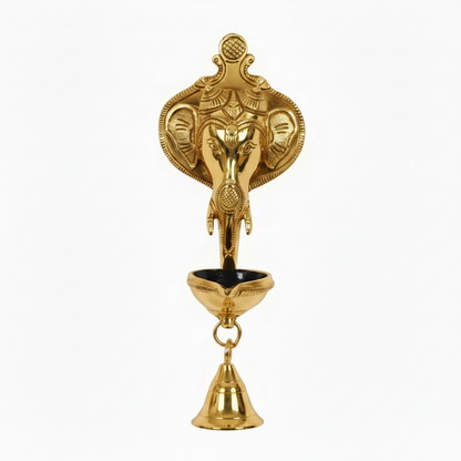 A  gold finish Lord Ganesha wall-hanging diya featuring a detailed Ganesha head backplate, a single-wick oil lamp bowl with a black interior, and a hanging brass bell for home temple or pooja room decoration.