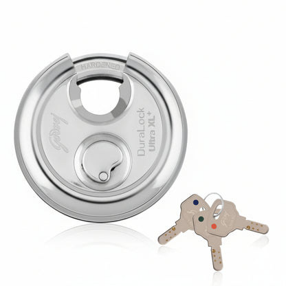 Godrej Duralock Ultra XL+ high-security disc padlock in a polished silver finish, featuring a hardened steel shackle, a drill-resistant body, and three computer-aided 'Ultra' dimple keys with color-coded ID tags for easy identification.