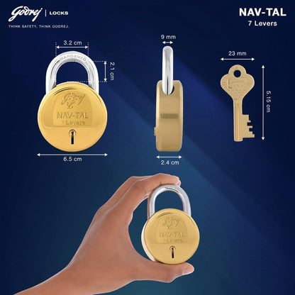 Technical dimension diagram for the Godrej NAV-TAL 7-lever padlock showing a 6.5 cm body width, 2.4 cm thickness, 9 mm hardened steel shackle diameter, and a 5.15 cm long brass key with a 23 mm wide head.