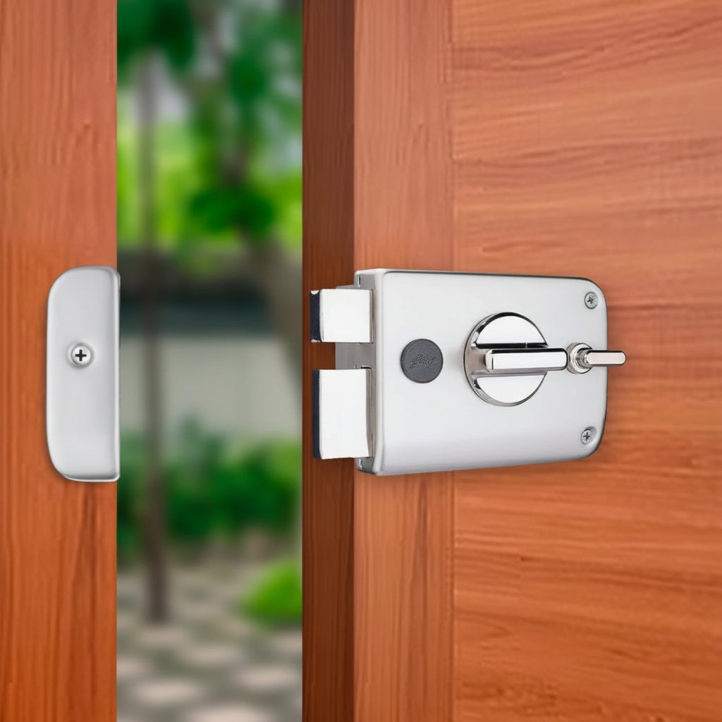 Godrej Twinbolt Ultra XL rim lock in a premium satin nickel finish, installed on a modern wooden main door featuring a double-bolt mechanism, integrated privacy knob, and a matching striker plate for enhanced residential security.