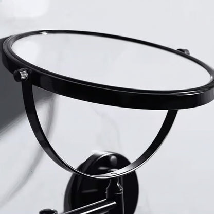 Close-up of the Grafiqe circular vanity mirror in a black finish, showcasing the 360-degree vertical swivel pivot and the high-clarity glass set within a sleek, minimalist metallic frame.