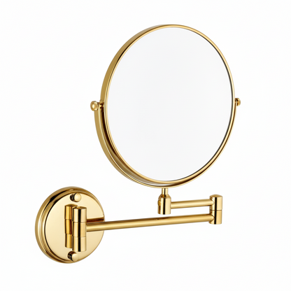 Grafiqe wall-mounted circular vanity mirror in a brilliant gold finish, featuring an adjustable double-swivel telescopic arm and a 360-degree rotating mirror head for precision makeup and shaving.