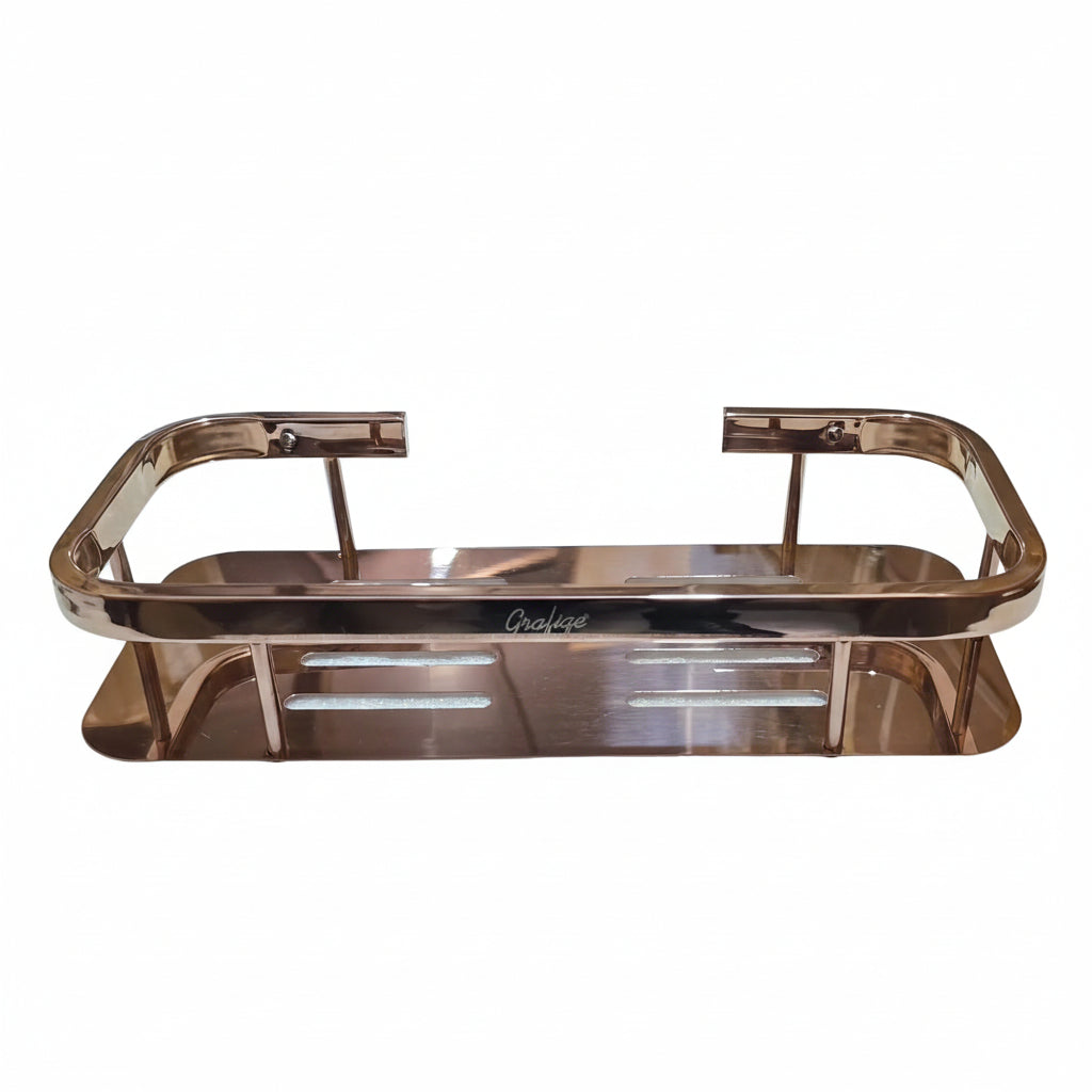 Grafiqe rectangular wall-mounted bathroom shelf in a polished rose gold finish, featuring an engraved brand logo, horizontal laser-cut drainage slots, and a raised safety guard rail for premium shower storage.