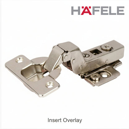 A professional-grade Hafele inset overlay concealed cabinet cup hinge made of durable nickel-plated steel. The image displays a high-crank hinge arm and mounting plate with adjustment screws, specifically engineered for cabinet doors that sit flush within the cabinet frame.
