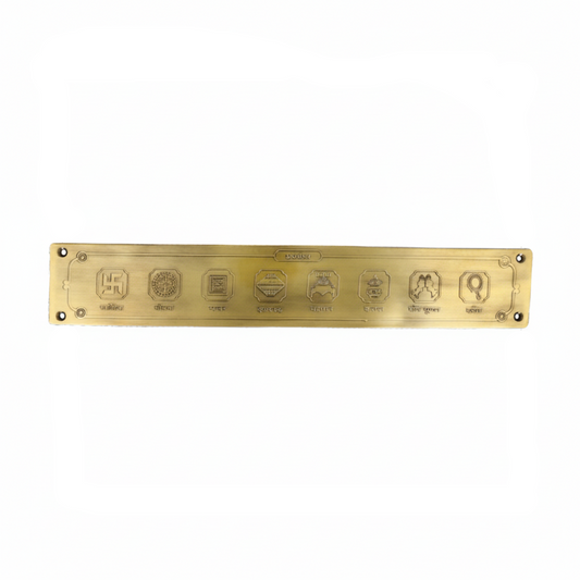 A horizontal Jain Ashta Mangala wall plaque crafted in antique brass, featuring the eight auspicious symbols including the Swastika, Shrivatsa, and Kalash, designed for pooja room or temple entrance mounting.