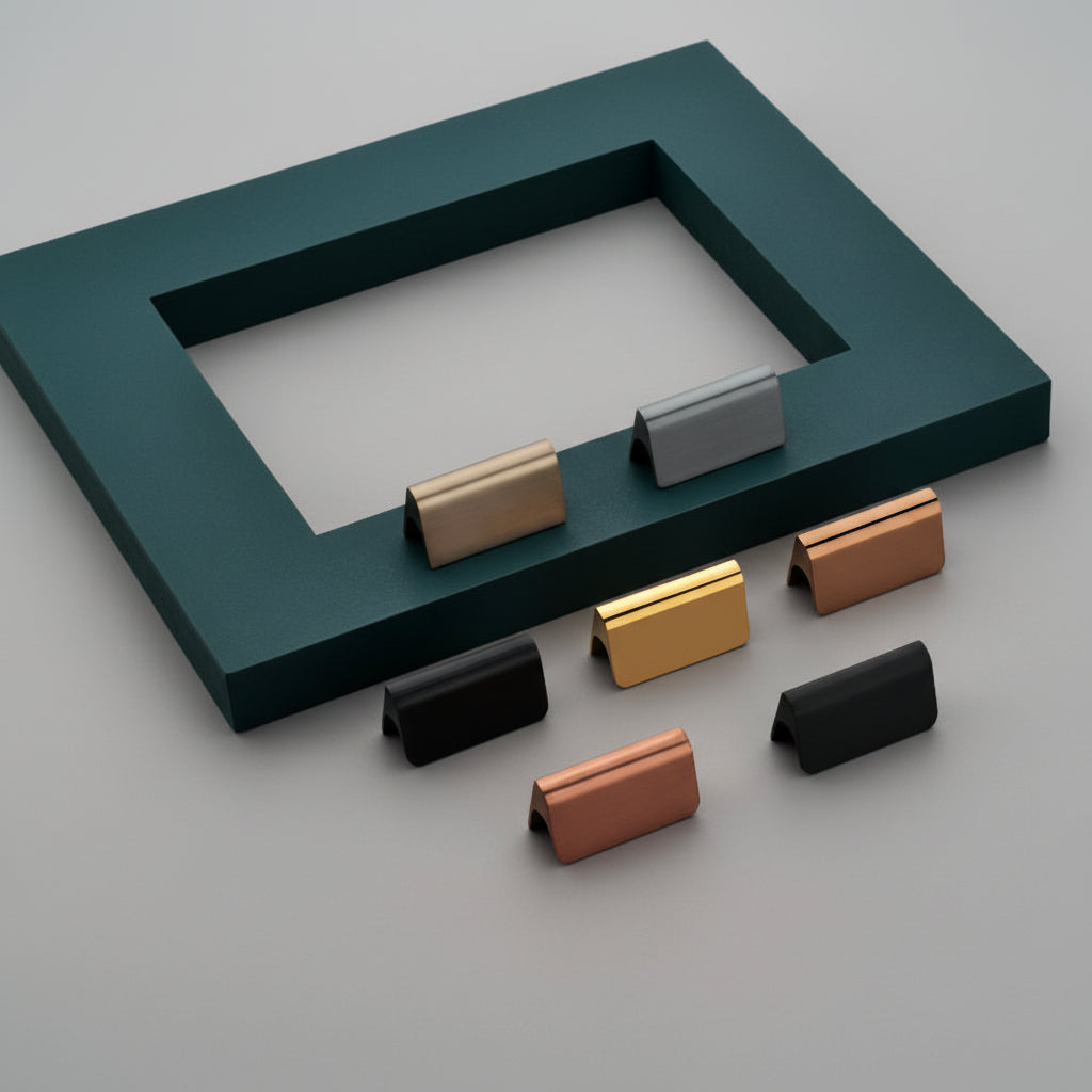 A collection of Creatick KB-52 modern square cabinet knobs with smooth, domed tops. These elegant furniture knobs are displayed in matte black, polished gold, rose gold, brushed satin grey, and cream finishes, arranged on a textured surface with a teal accent—ideal for high-end kitchen cabinets and minimalist drawer hardware.