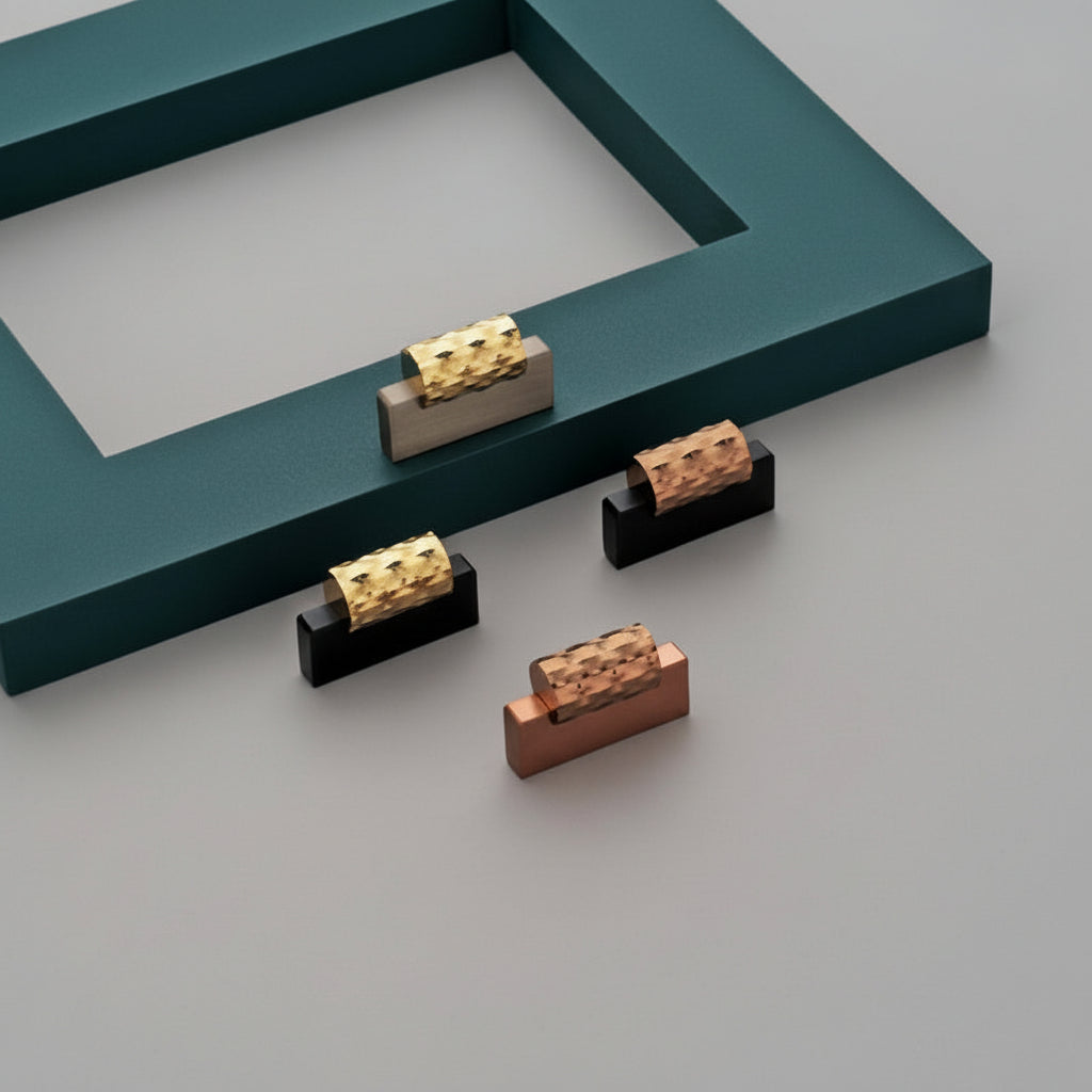 A collection of Creatick KB-73 modern cabinet knobs featuring a unique two-tone design with a textured, hammered-style top grip. These premium hardware pieces are shown in a variety of elegant finishes, including gold, rose gold, black, and satin, paired with matte and glossy rectangular bases. Perfect for adding a luxurious and contemporary touch to kitchen cabinets, wardrobe doors, and luxury furniture pieces.