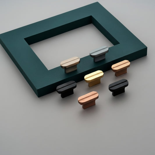 A premium showcase of Creatick KB-75 modern cabinet knobs, featuring a minimalist T-bar design with a sleek center groove detail. This collection highlights a versatile range of high-quality finishes, including matte black, rose gold, satin nickel, gray, and classic gold. These contemporary hardware pieces are designed to elevate the aesthetic of kitchen cabinetry, designer wardrobes, and high-end furniture.
