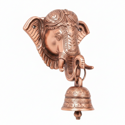 A rose gold finish Lord Ganesha wall-mounted hanging bell featuring a highly detailed Ganesha face with an ornate crown and a decorative hanging puja bell, designed for home temple or entrance decoration.