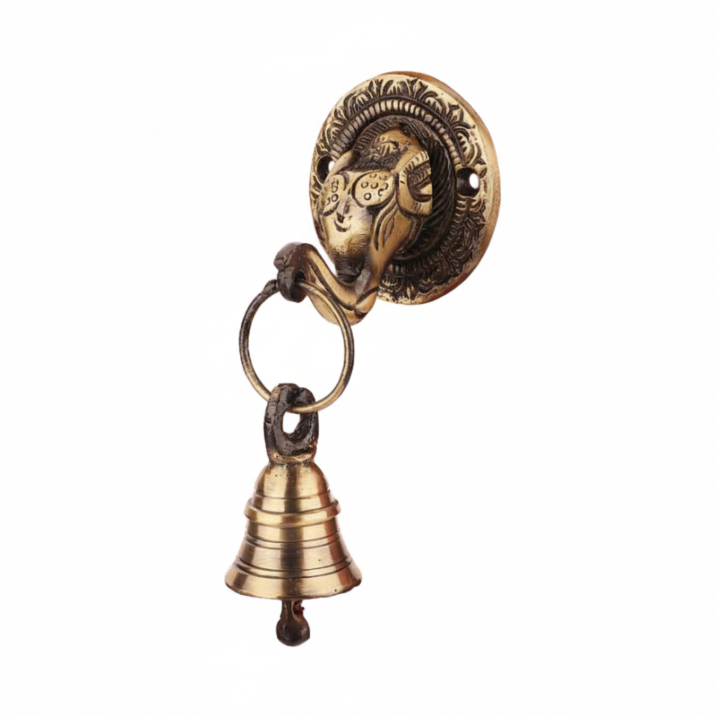 An antique brass wall-mounted hanging bell featuring a decorative Lord Ganesha head on a circular backplate with a small hanging puja bell, designed for home temple or pooja room decoration.