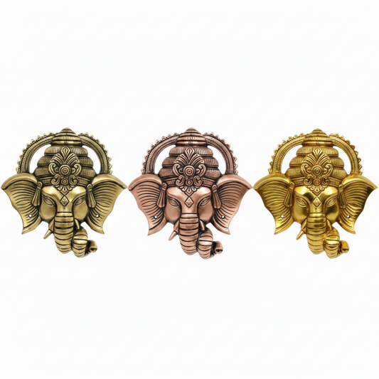 Decorative Lord Ganesha wall hangings featuring detailed faces with ornate crowns in various metallic finishes, including antique brass, rose gold and gold, for home temple or entryway decoration.