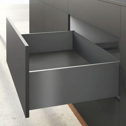 An open high-capacity kitchen drawer featuring a premium matte anthracite finish and ultra-slim double-wall sides. The deep drawer is integrated into a modern dark handle-less cabinet system, showcasing a minimalist aesthetic and high-performance hardware designed for large-volume interior organization.