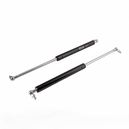 A pair of professional-grade pneumatic gas struts featuring a sleek black finish and high-pressure hydraulic rods. These lift supports come equipped with adjustable metal ball joint connectors for smooth, silent operation. Ideal for supporting heavy cabinet doors, automotive hoods, and storage lids, ensuring a safe and controlled soft-close motion.