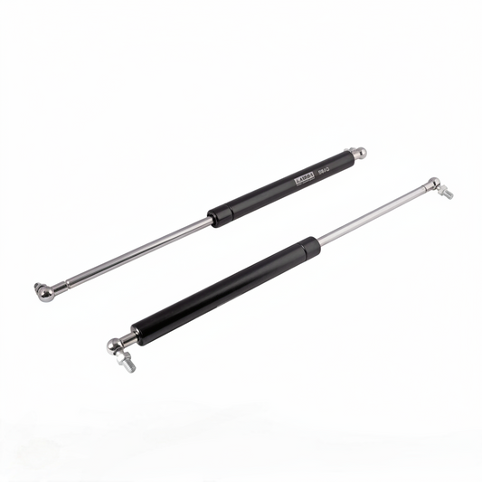 A pair of professional-grade pneumatic gas struts featuring a sleek black finish and high-pressure hydraulic rods. These lift supports come equipped with adjustable metal ball joint connectors for smooth, silent operation. Ideal for supporting heavy cabinet doors, automotive hoods, and storage lids, ensuring a safe and controlled soft-close motion.