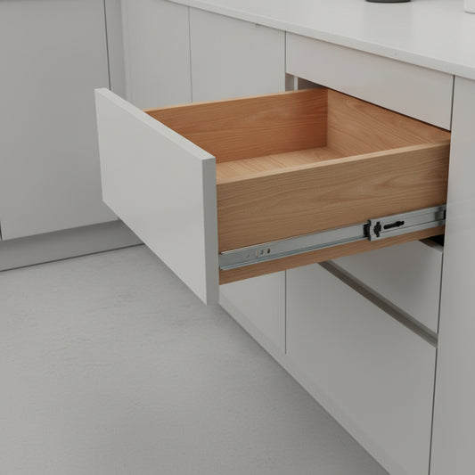 A clean, modern white kitchen cabinet featuring an open wooden drawer installed with Aeron soft-close telescopic drawer channels. The image demonstrates the smooth full-extension capability of the hardware, highlighting the professional-grade zinc-plated finish and integrated hydraulic mechanism designed to provide a silent, slam-free closing experience for premium home cabinetry.
