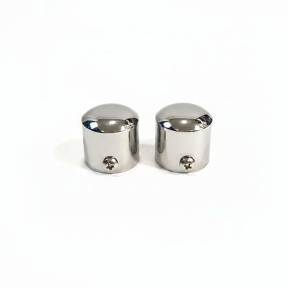 A pair of high-quality stainless steel end caps for glass railings featuring a polished chrome finish. These durable balustrade fittings include integrated side screws for secure mounting on round handrail posts, providing a clean and professional finish to modern architectural railing systems.